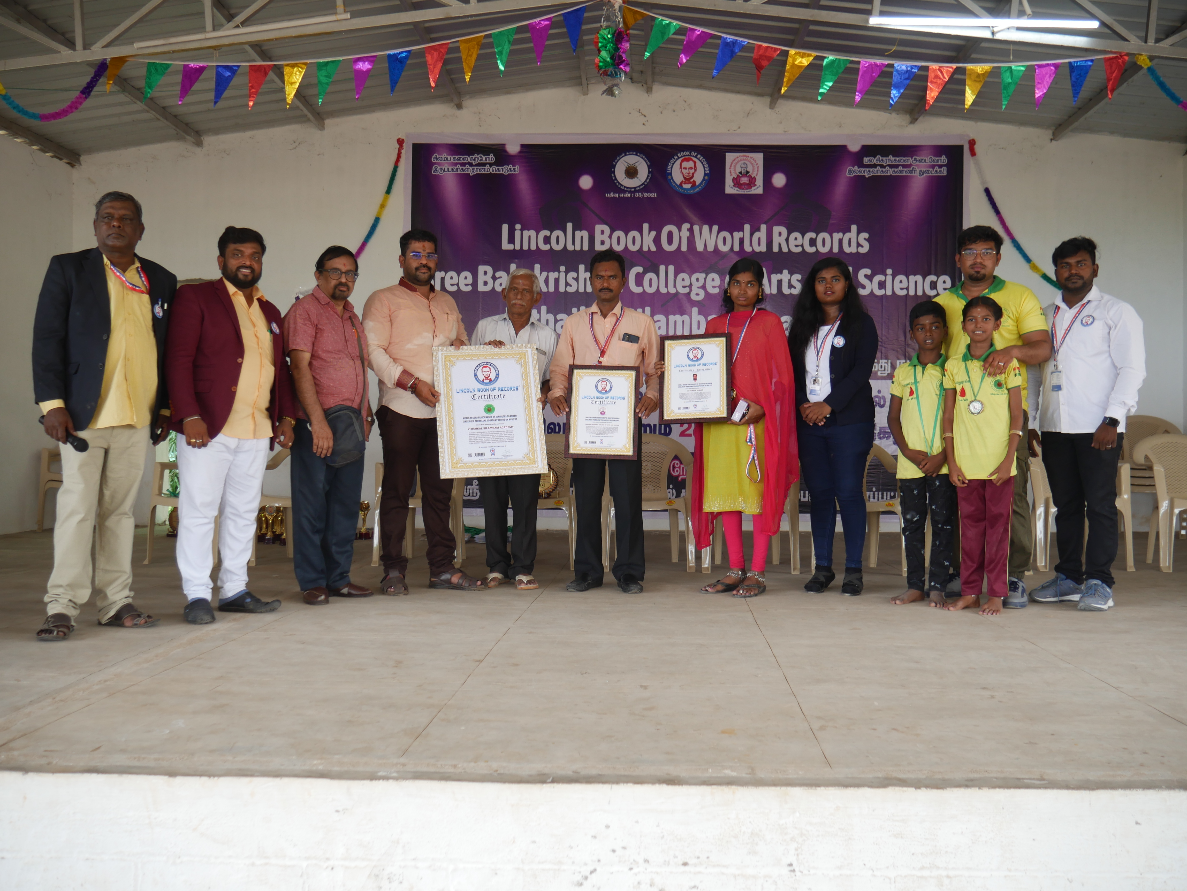 World record performance of 30 minutes Silambam  circling in Padmasana yogasan posture on mud pot.