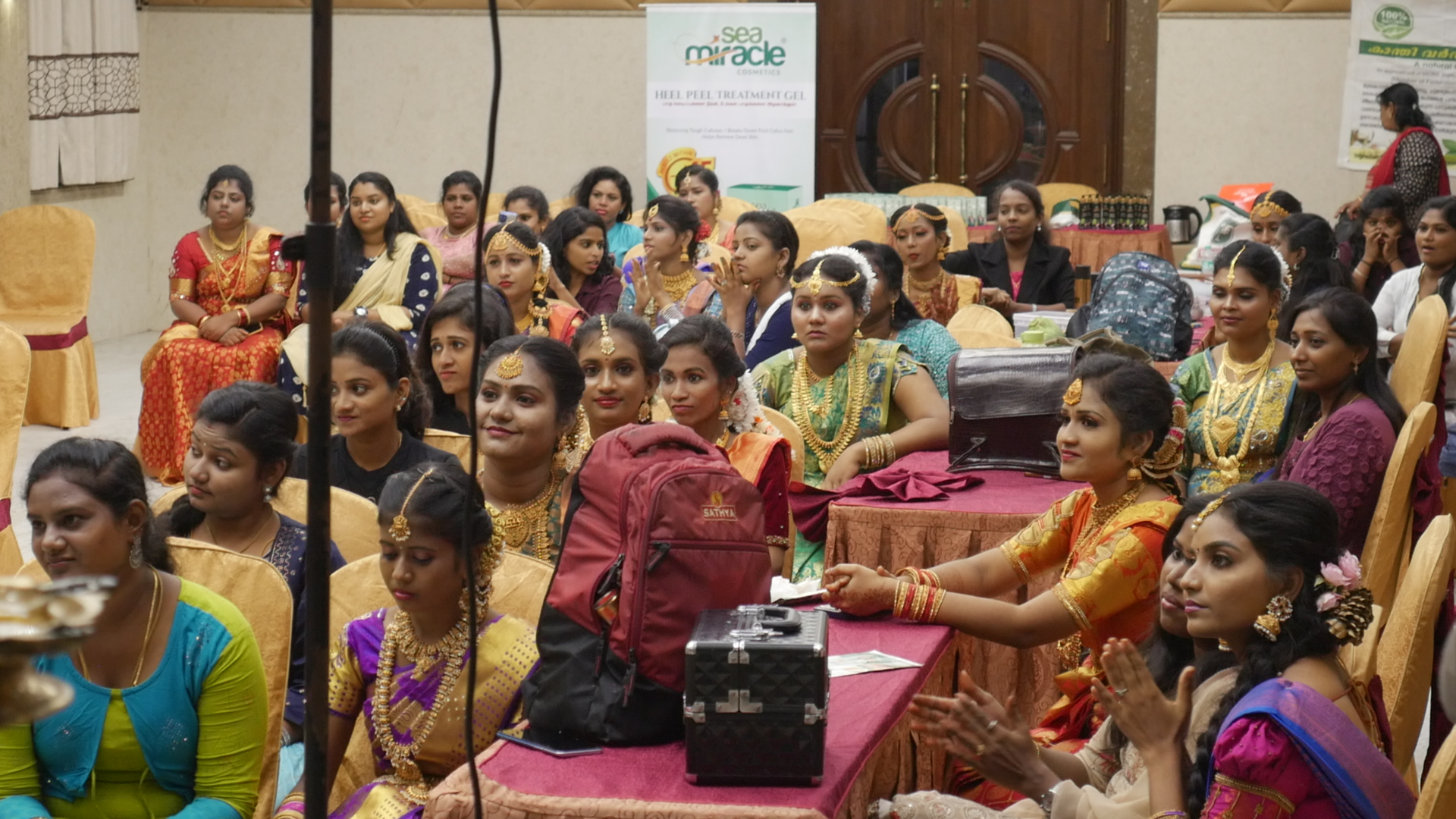 Most number of beauticians gathered together  performing Hindu bridal makeup on models in least time.